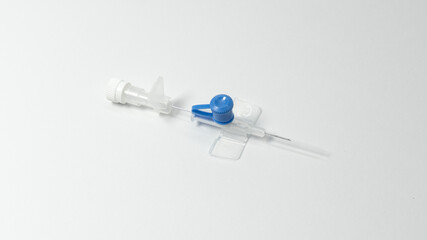 IV cannula with needle partially withdrawn from the catheter. Sterile medical device placed on...