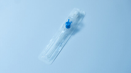 Unopened intravenous cannula in transparent blister packaging. Sterile medical device ready for use...