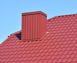 Chimney on the roof of the house.