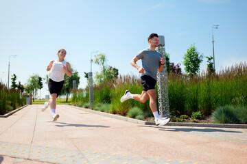 Exciting morning run in a sunlit park with vibrant greenery and active participants enjoying...