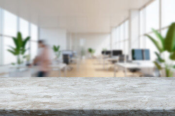 Modern office environment with blurred background and focus on marble countertop at daytime
