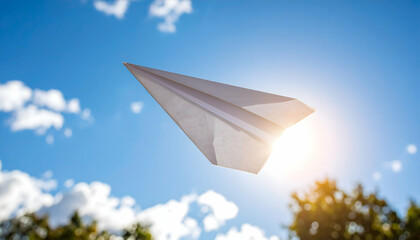Paper plane soaring with sunny sky.