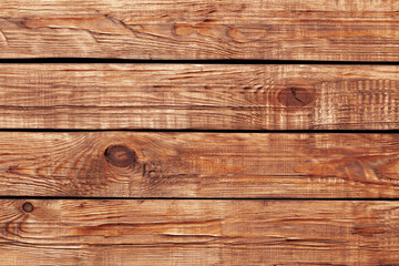 Wooden planks with natural grain patterns in a rustic setting create a warm and inviting atmosphere...