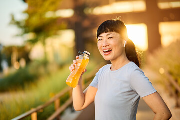 Portrait of a young beautiful sport woman smiling happy and confident. Standing and  doing exercise...