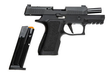 Black pistol with open slide and detached magazine on white back