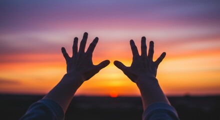Silhouetted hands reach towards a vibrant sunset, fingers spread wide, evoking a sense of hope and peace