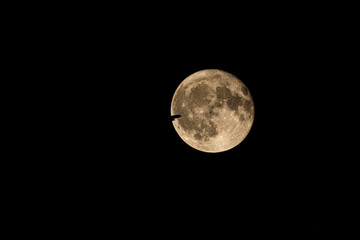 Air plane full moon. A photograph of a jet airplane in the moon. 