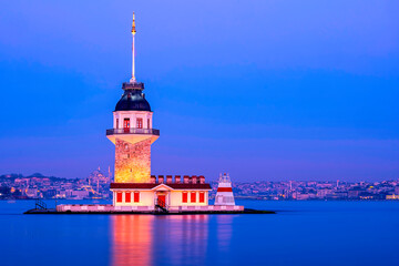iery sunset over Bosphorus with famous Maiden's Tower (Kiz Kulesi) also known as Leander's Tower, symbol of Istanbul, Turkey. Scenic travel background for wallpaper or guide book