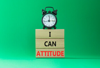 I Can Attitude symbol. Wooden blocks with words I Can Attitude. Beautiful green background with...