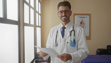 Man reading medical document by window in clinic consultation room; knowledge dedication empathy...