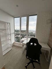 Modern Home Office with Panoramic Window and Minimalist Desk