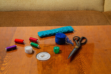 Sewing and knitting threads, knitting needles, measuring tape, needles