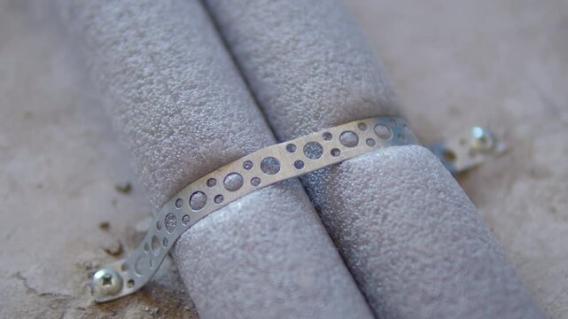 Insulated pipes fixed with perforated metal strap