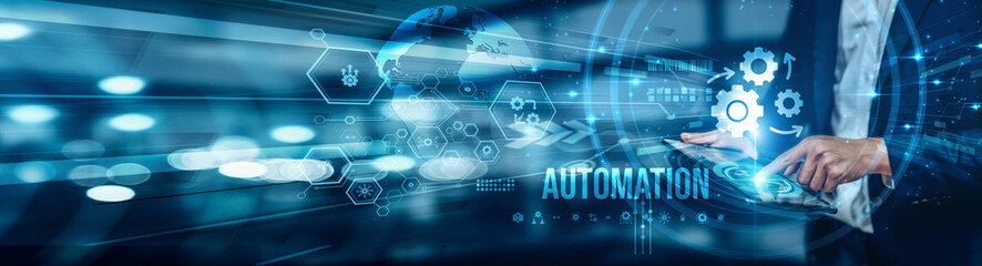 Businessman using tablet analyzing automation trends, optimizing workflows, reducing errors, and enhancing productivity through smart automated solutions and data-driven decision-making processes.