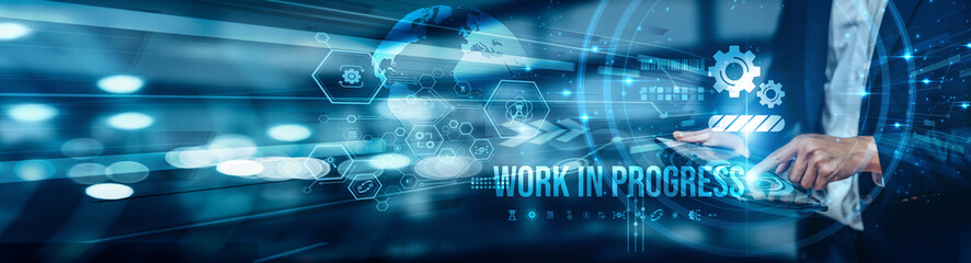 Businessman using tablet analyzing Work In Progress to monitor project status, track progress, and...