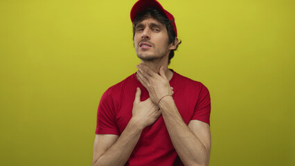 Delivery man in red uniform clutching throat and grimacing with strained expression in yellow...