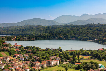 Aerial view of Avigliana lake, Italy, Piedmont, Turin, Italy A beautiful town with and red-roofed...
