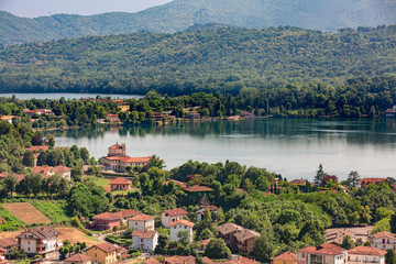 Aerial view of Avigliana lake, Italy, Piedmont, Turin, Italy A beautiful town with and red-roofed...