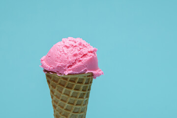 Pink Ice Cream cone isolated on blue background
