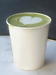 Matcha Latte in Paper Cup with Heart Foam Art

