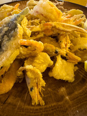 Golden crispy fried seafood platter with shrimp and fish