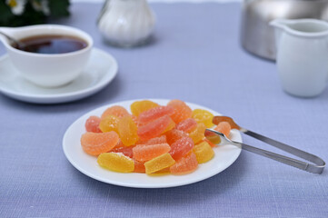 still life with marmalade dessert and a cup of tea on the table