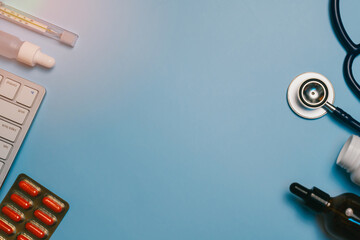 Medical flat lay background. Medical and Health Tools with Pharmacy Items on Blue Background for...