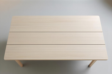 A top view of a light wood dining table with three planks