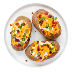 Loaded baked potatoes with cheese, sour cream, bacon and onions. Top view plate isolated on a white background.
