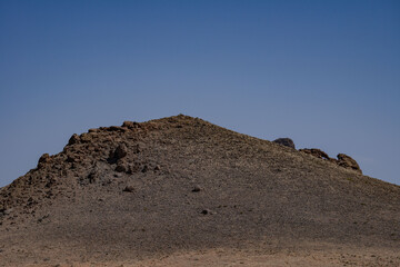 near Chaistla Butte  located south of Monument Valley, in Navajo County of northeast Arizona. eroded volcanic plugs, or diatremes, of the Navajo Volcanic Field. Volcanic breccia. U.S. Route 163 