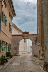Historic stone archway in medieval Croatian village Visnjan.
