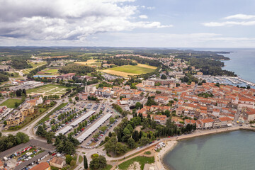 Aerial drone view of Porec coast and town in Croatia.