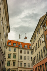 Living houses with red roofs in the center of the Copenhagen on a gloomy day 