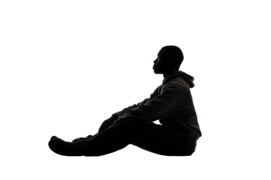 PNG Silhouette of an african male teen sitting in profile against black background