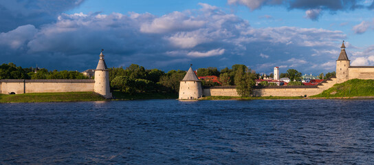 Beautiful panoramic evening view of the Pskov Kremlin from Olginskaya embankment. Pskov, Russia.