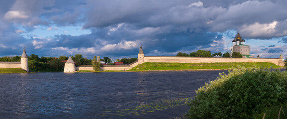 Beautiful panoramic evening view of the Pskov Kremlin from Olginskaya embankment. Pskov, Russia.
