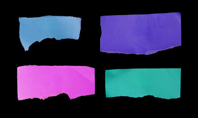 Collection of torn ripped paper on black background.