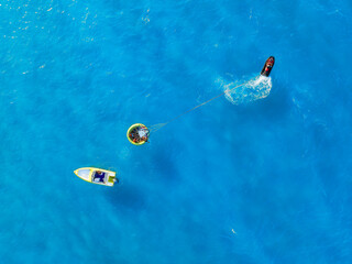 Vacation and leisure. Aerial view on fast boat on blue sea at sunny day. Fast ship on the sea...