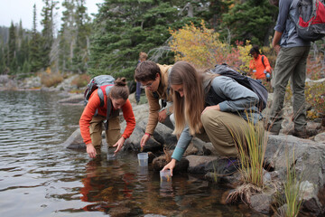 Conducting Young Students Field Research by a Mountain Lake