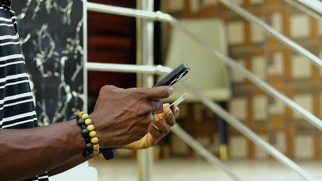copy space video of hand holding mobile phone and bank card