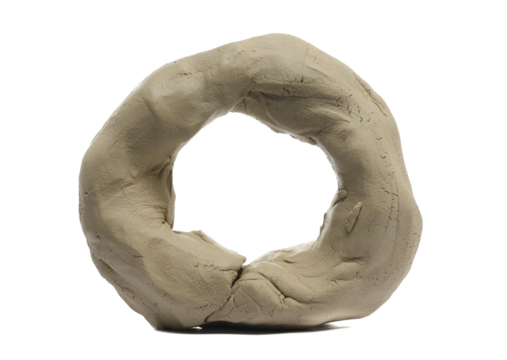 Clay modelling in shape ring, isolated on white