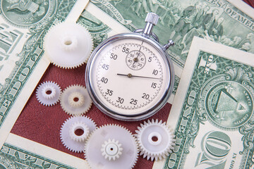 mechanical stopwatch on the background of dollars. Part time accuracy for business. business and...