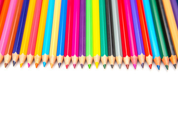 Multicolored pencils lined up in a neat row on a white backdrop, showcasing a rainbow of colors....