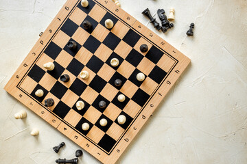 Top view of chess pieces and chessboard during the game