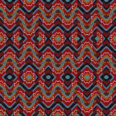 Tribal pixel illustrations or beautifully woven ethnic fabrics mix with interconnecting geometric zigzags and basic diamond motifs for an elegant hand-loomed tapestry.