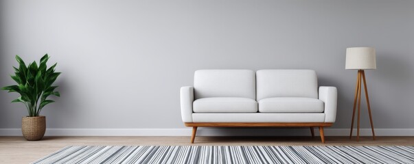 Decluttered home decor idea. Modern living room with couch, lamp, and plant decor.
