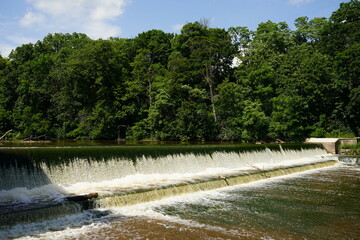 Waterfall dam flowing into the Sheboygan River at Settlers Park in Sheboygan Falls, Wisconsin. 