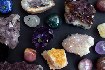 Background of beautiful natural colored semi-precious stones. Purple fluorite, rose quartz and...