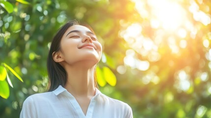 Woman breathes fresh air, sunlight, green leaves background, serenity, wellbeing