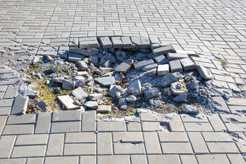 crater from a mine explosion on the bridge square of the city during the war in Ukraine © photosaint